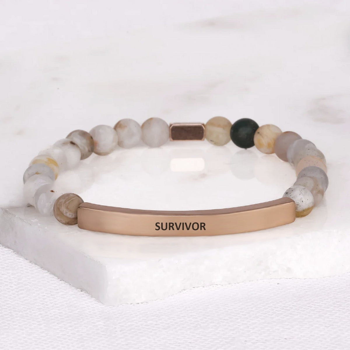 engraved stainless steel message bar bracelet symbolizing strength and resilience