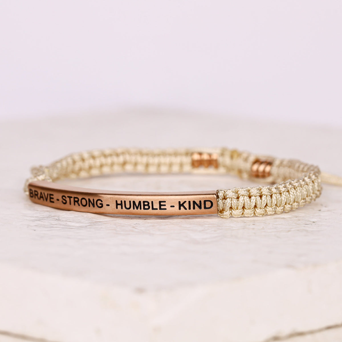Adjustable rope bracelet with engraved message
