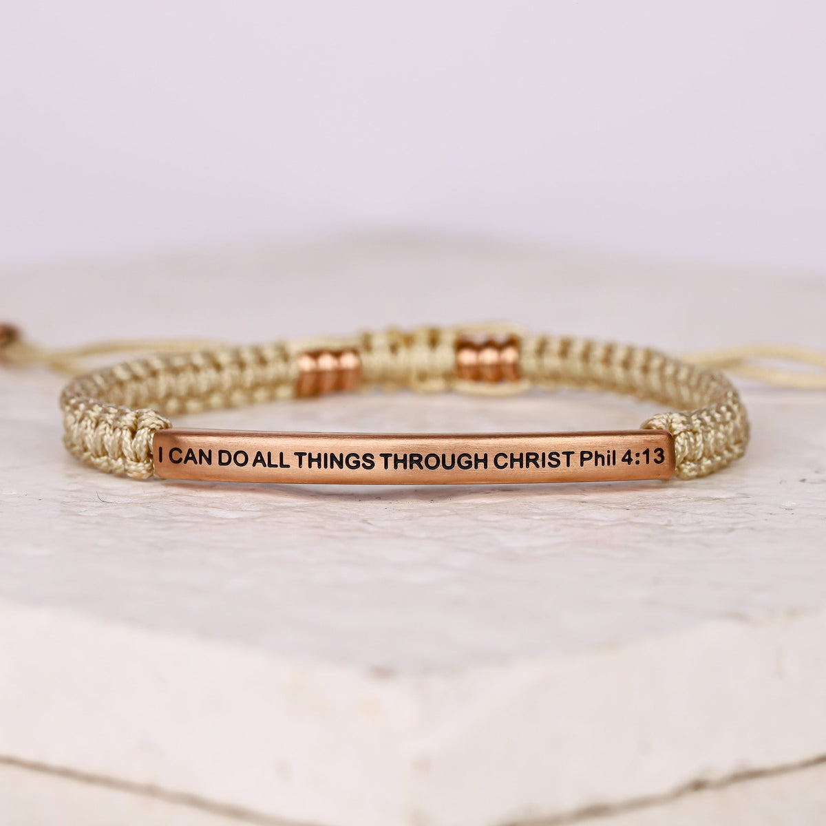 Tan rope bracelet with engraved message