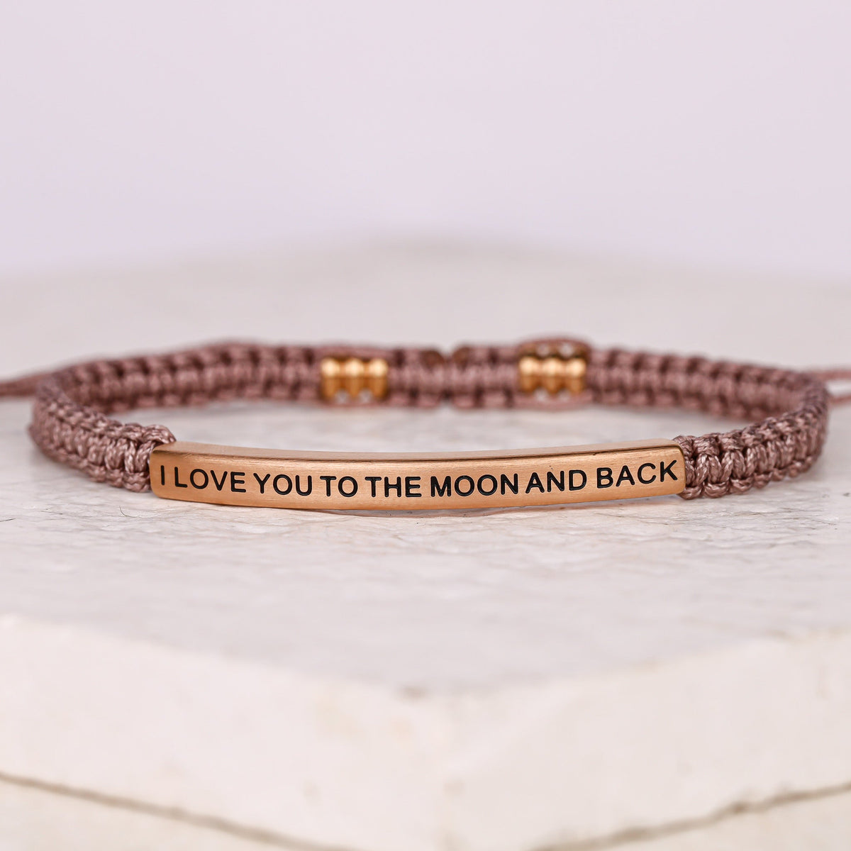 adjustable rope I LOVE YOU TO THE MOON AND BACK bracelet featuring a stainless steel inspirational message bar