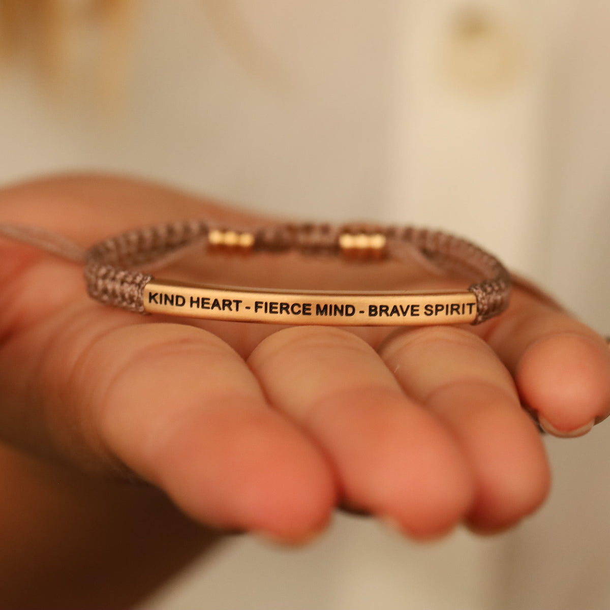 Rope bracelet featuring engraved MESSAGE