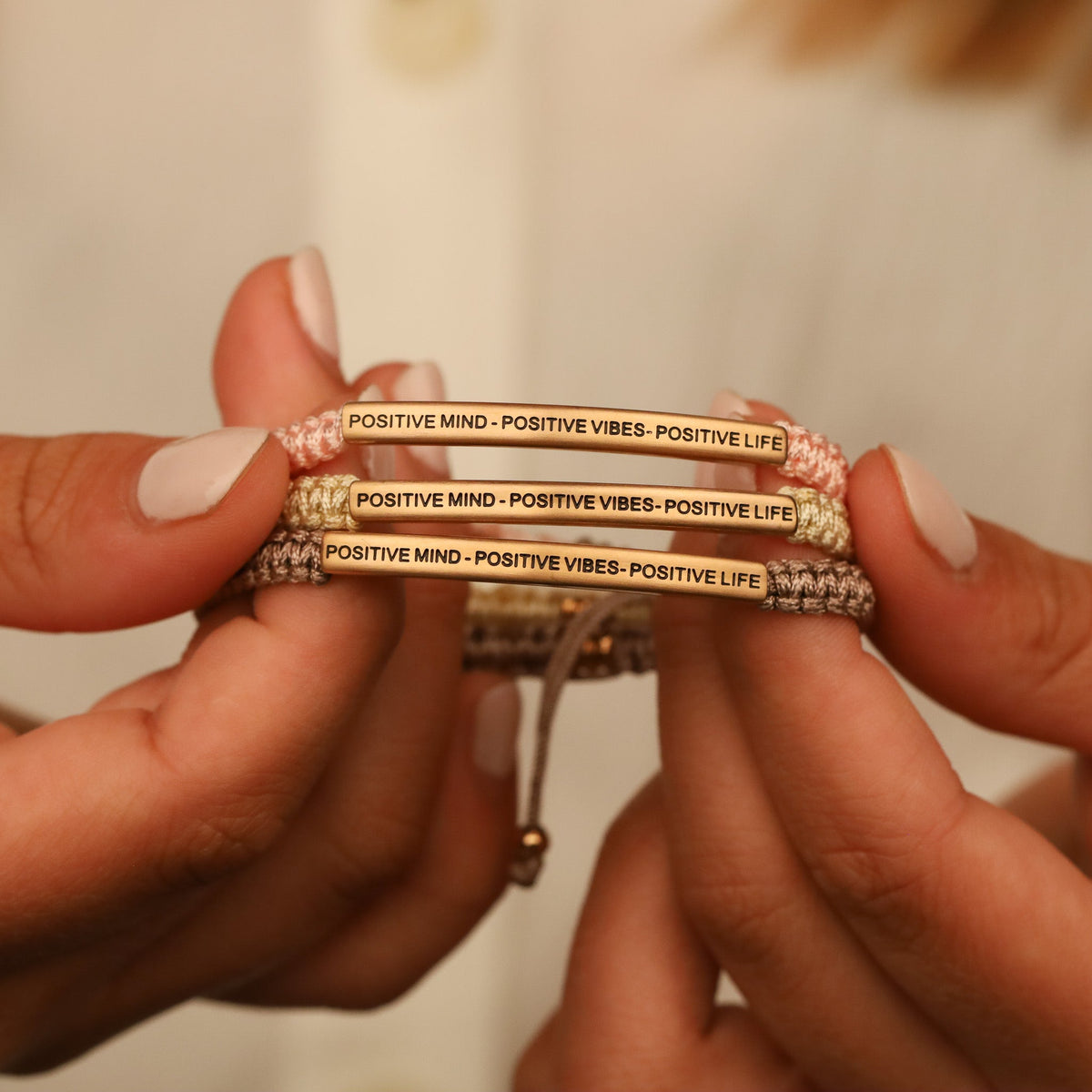 Rope bracelet engraved with “Positive Mind Positive Vibes Positive Life”