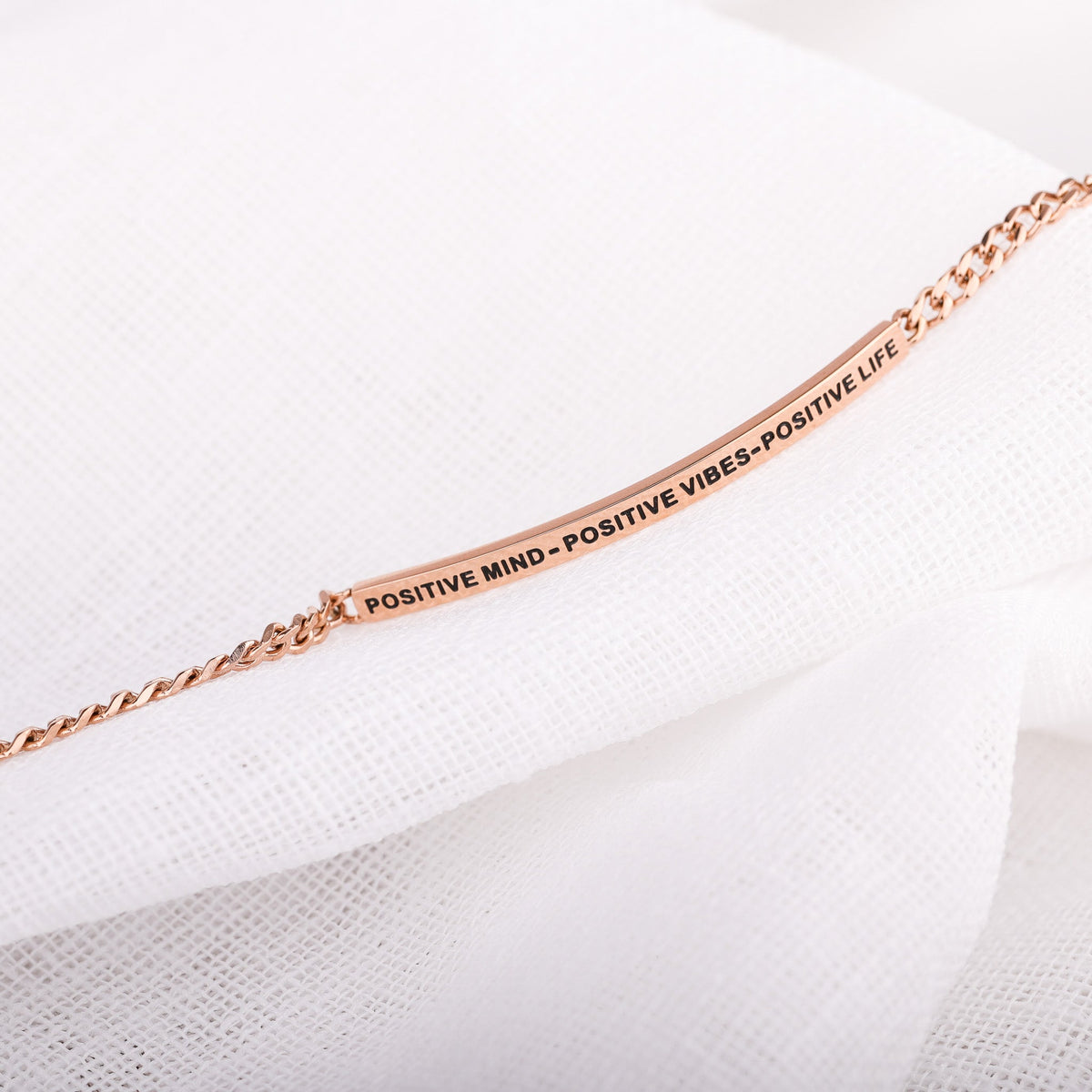 Close-up of Positive Mind Positive Vibes Positive Life chain bracelet showing engraved message