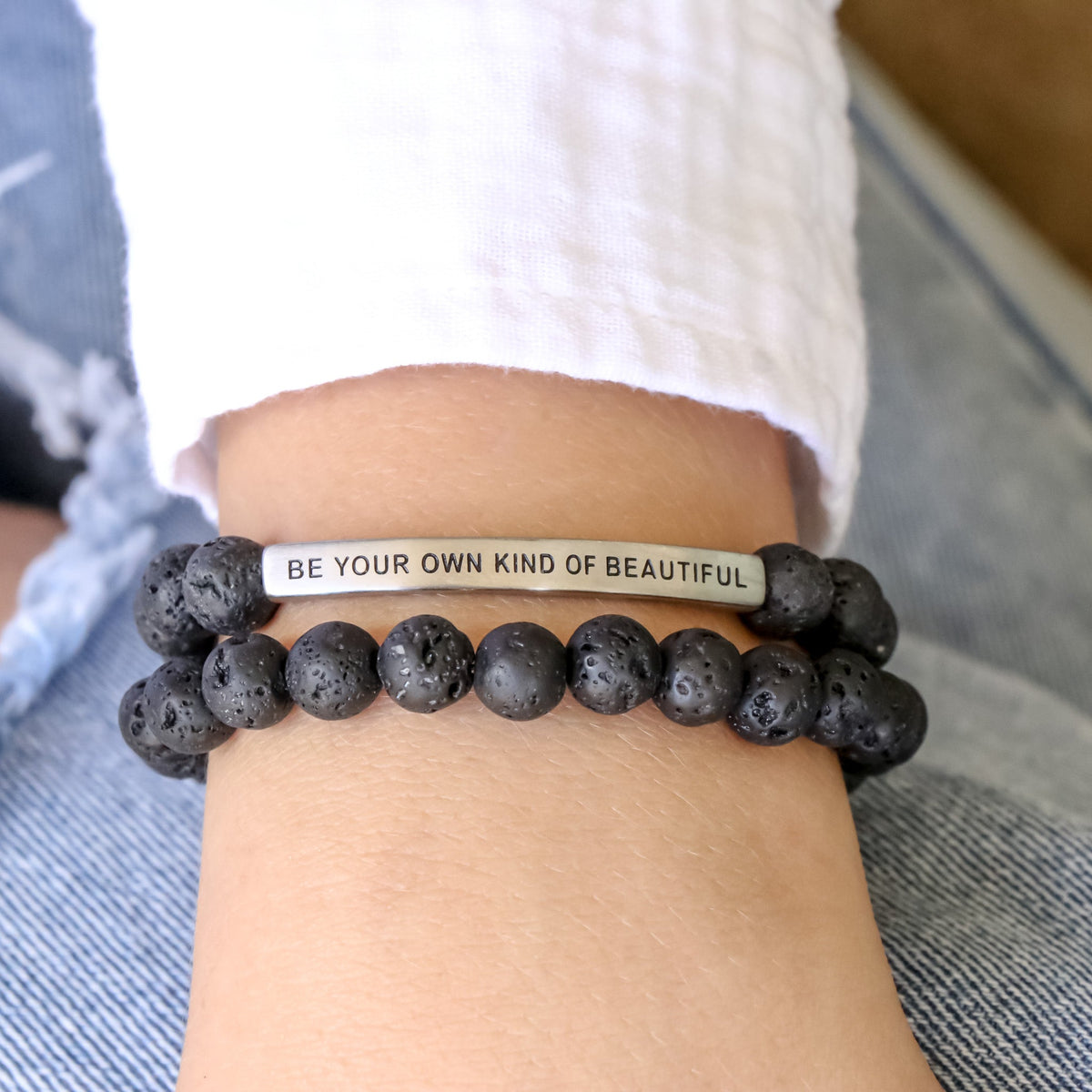 Black bracelet with engraved bar