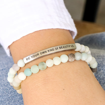 Blue  beaded bracelet with engraved bar