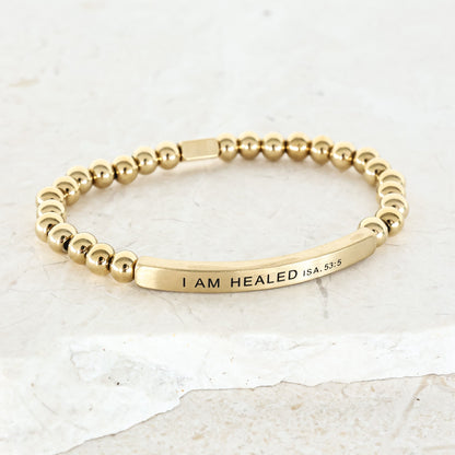 gold beaded bracelet with engraving