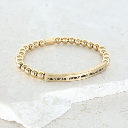 gold engraved beaded bracelet