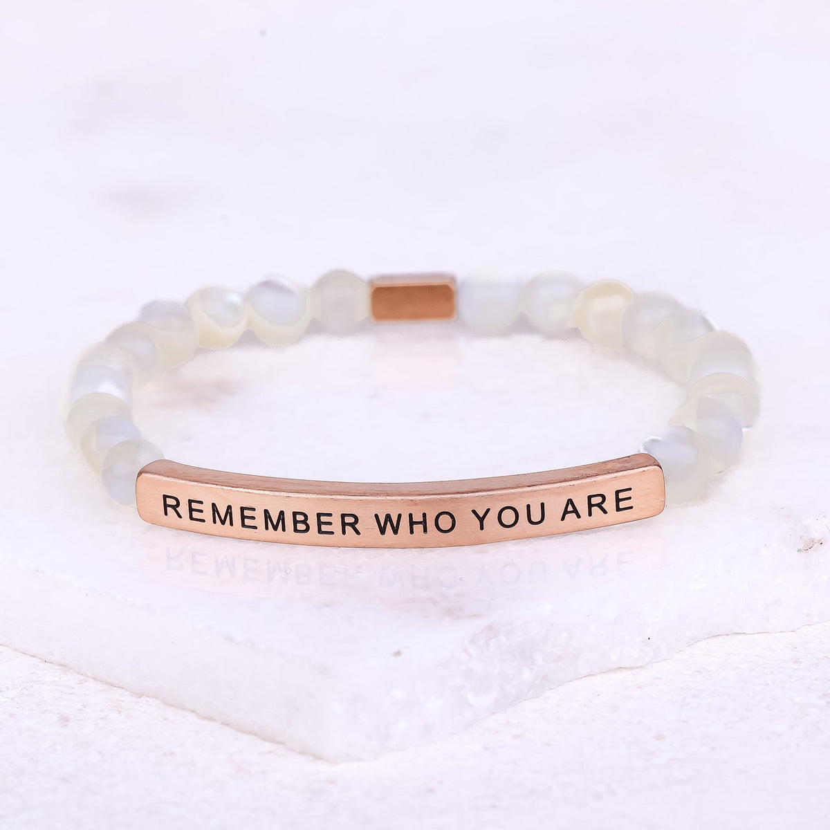 Remember Who You Are bracelet worn on wrist with gemstone beads