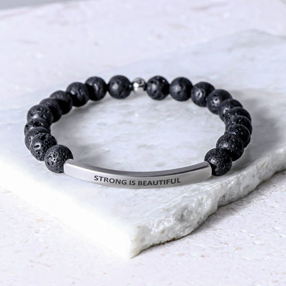 Strong Is Beautiful beaded message bracelet symbolizing courage, resilience, and inner beauty