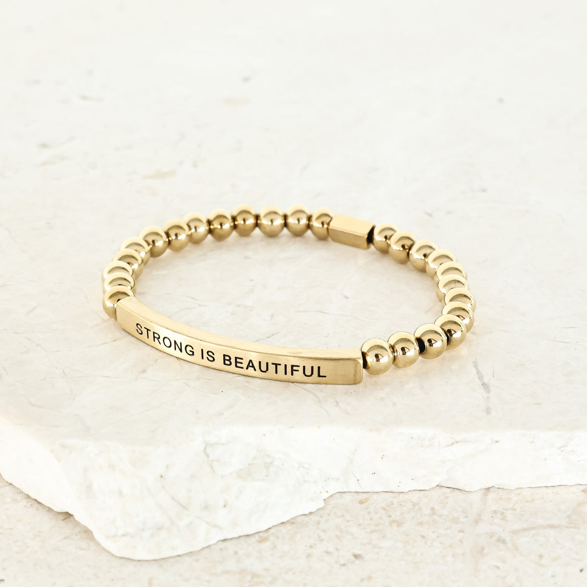 STRONG IS BEAUTIFUL bracelet for women celebrating strength, confidence, and self-worth