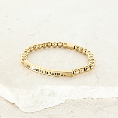 STRONG IS BEAUTIFUL bracelet for women celebrating strength, confidence, and self-worth