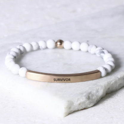 SURVIVOR bracelet representing courage, resilience, hope, and personal strength