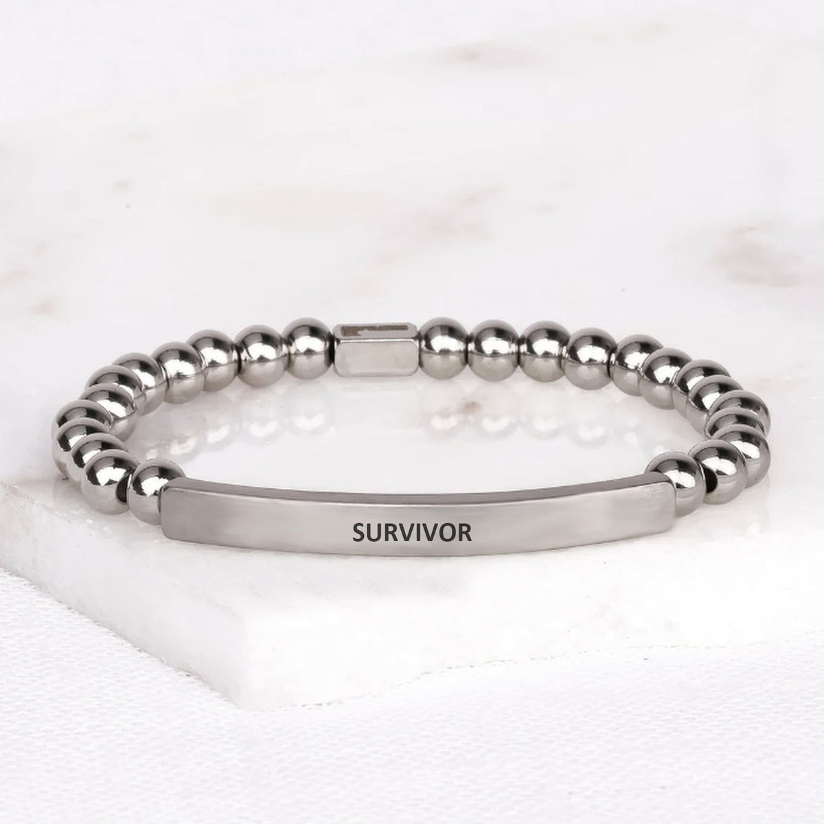 Survivor gemstone bracelet with engraved message, a meaningful gift for cancer survivors