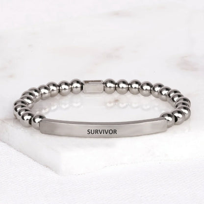 Survivor gemstone bracelet with engraved message, a meaningful gift for cancer survivors