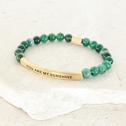 inspirational message bracelet offering a reminder of love, positivity, and happiness