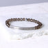 Crystal beaded bracelet with engraved bar