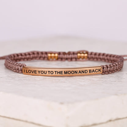 adjustable rope I LOVE YOU TO THE MOON AND BACK bracelet featuring a stainless steel inspirational message bar