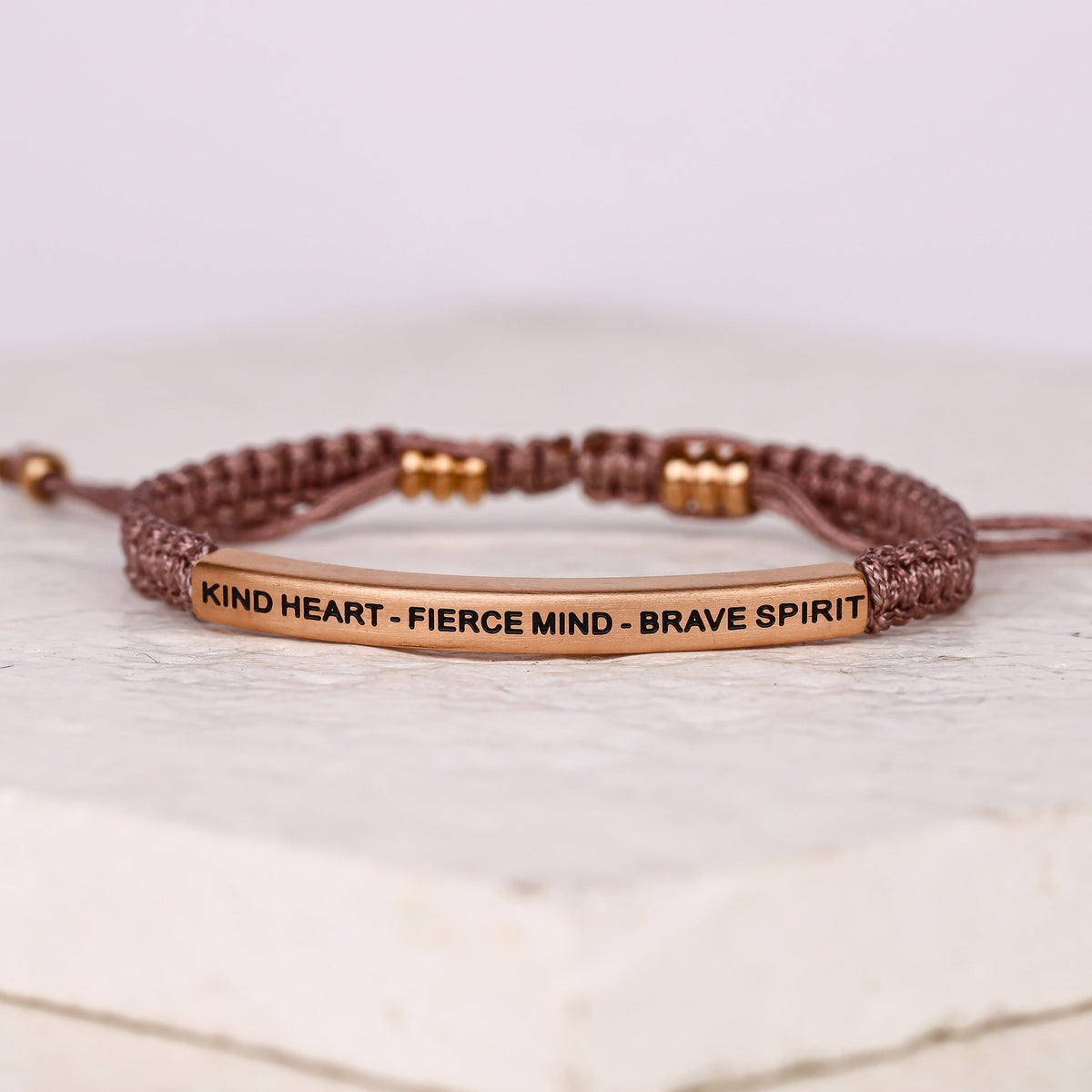 Rope bracelet featuring engraved Kind Heart Fierce Mind Brave Spirit message bar