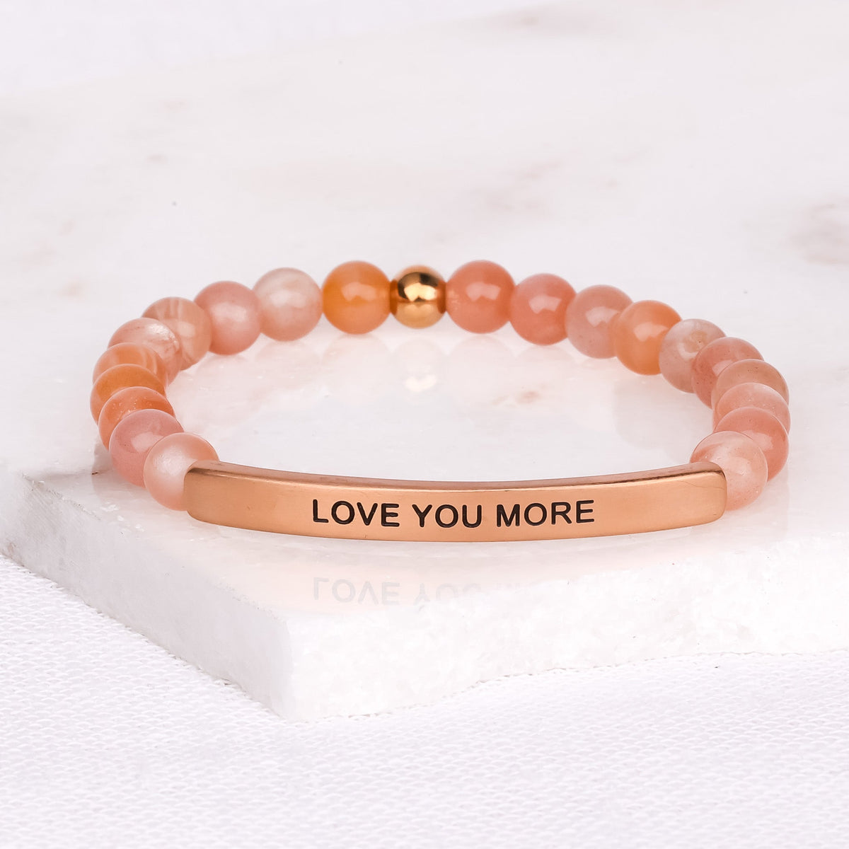 Meaningful love bracelet featuring Love You More message and gemstone beads