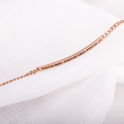 Close-up of Positive Mind Positive Vibes Positive Life chain bracelet showing engraved message