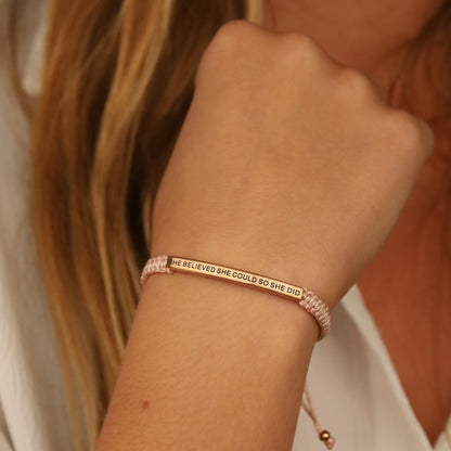 Rope bracelet engraved with “She Believed She Could So She Did”