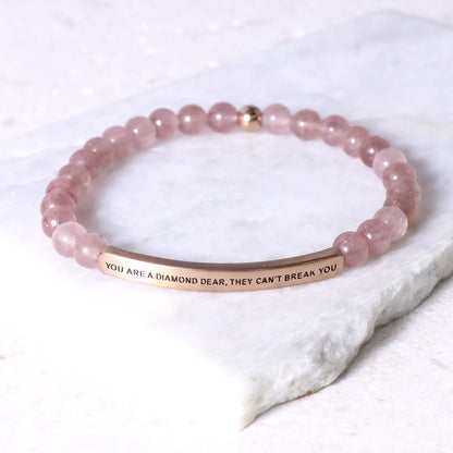 pink beaded engraved bracelet