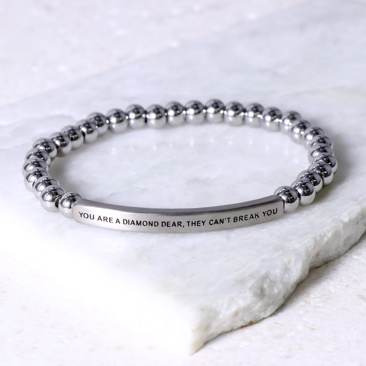 earth stone engraved bracelet